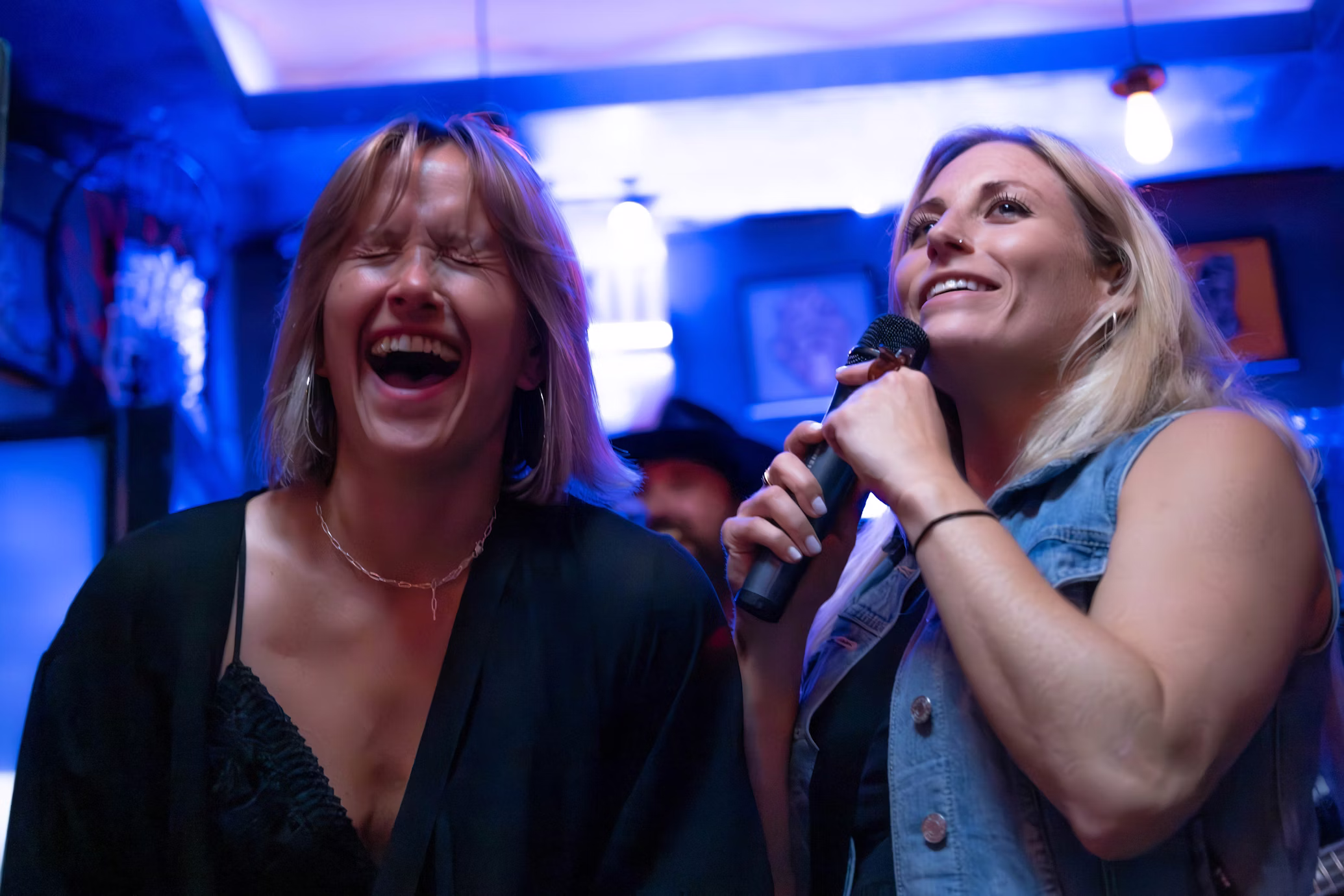 Karaoke night with friends, microphones and disco ball